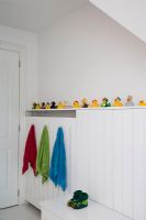Collection of rubber ducks in modern bathroom
