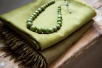 Green fabric and jewellery, detail 