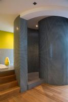 Modern bathroom with curved shower enclosure