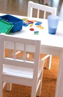 Table and chairs in childrens playroom