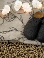 Close-up of a blanket and shoes