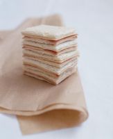 Sandwich with cheese and ham on brown paper