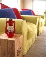 Lantern by armchairs in living room