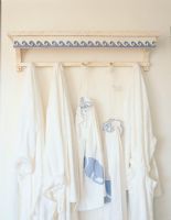 Clothes hanging on row of hooks 