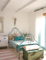 Vintage wrought iron bed in bedroom