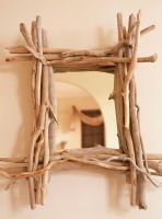 Mirror with a frame made from twigs