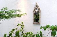 Mirror hanging in courtyard garden