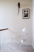 Hallway with Louis Ghost Chair by Philippe Starck for Kartell 