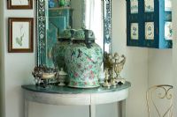 Console table with antiques on display