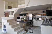 Compact kitchen under stairs