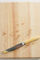 View of knife on chopping board, close-up
