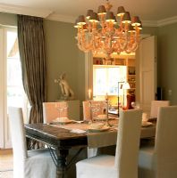 Modern dining room with elaborate chandelier