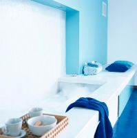 Interior of modern bathroom with bathtub and towel