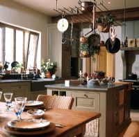 Interior of kitchen with worktop and utensils 