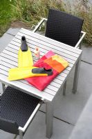 Swimming accessories on exterior table