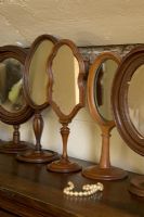 Collection of wooden mirrors detail 