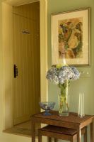 Flowers on table in classic hallway 