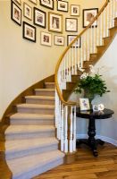 Curved staircase and pictures

