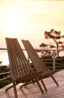 Folding wooden chairs on a deck patio