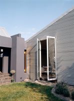 Modern home facade with corrugated iron wall