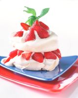 Meringue with strawberries, close-up 