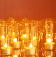 Grouping of glasses with votive candles