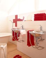 Bathroom sink with red towels