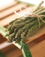 A bunch of asparagus on a wooden basket
