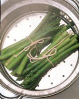 Two bunches of steamed asparagus