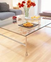 Glass coffee table with drinks and appetizers