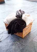 Blankets rolled up in a wicker basket