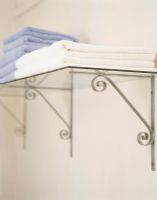 Stack of towels on glass shelf