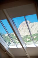 View of hillside through a skylight