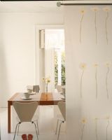 Dining table with coffee cup and flowers
