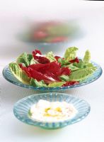 Close-up of a salad and hummus dip