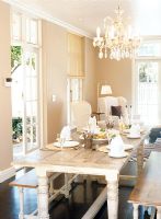 Place setting in dining room with chandelier