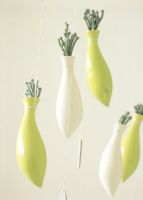Green and white hanging vases