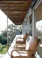 Armchairs on a sunny balcony