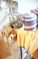 Kitchen utensils with knives in glass