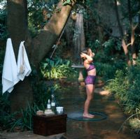 Young girl at an outdoor shower