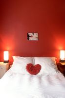 View of modern bedroom with heart shape symbol