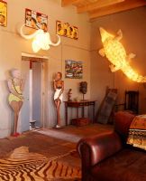 Living room with a large alligator lamp on the wall