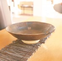 Bowl on a place mat made of twigs