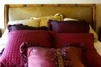 Colorful throw pillows on a large bed