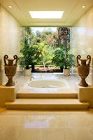 Marble steps leading to an elegant jacuzzi bathtub