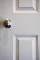 Interior door with brushed chrome doorknob