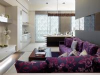 Modern purple sofa outside kitchen
