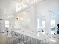 Marble dining table with clear plastic chairs
