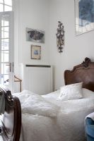 Classic bedroom with carved wooden headboard