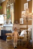Child mannequin in classic living room 